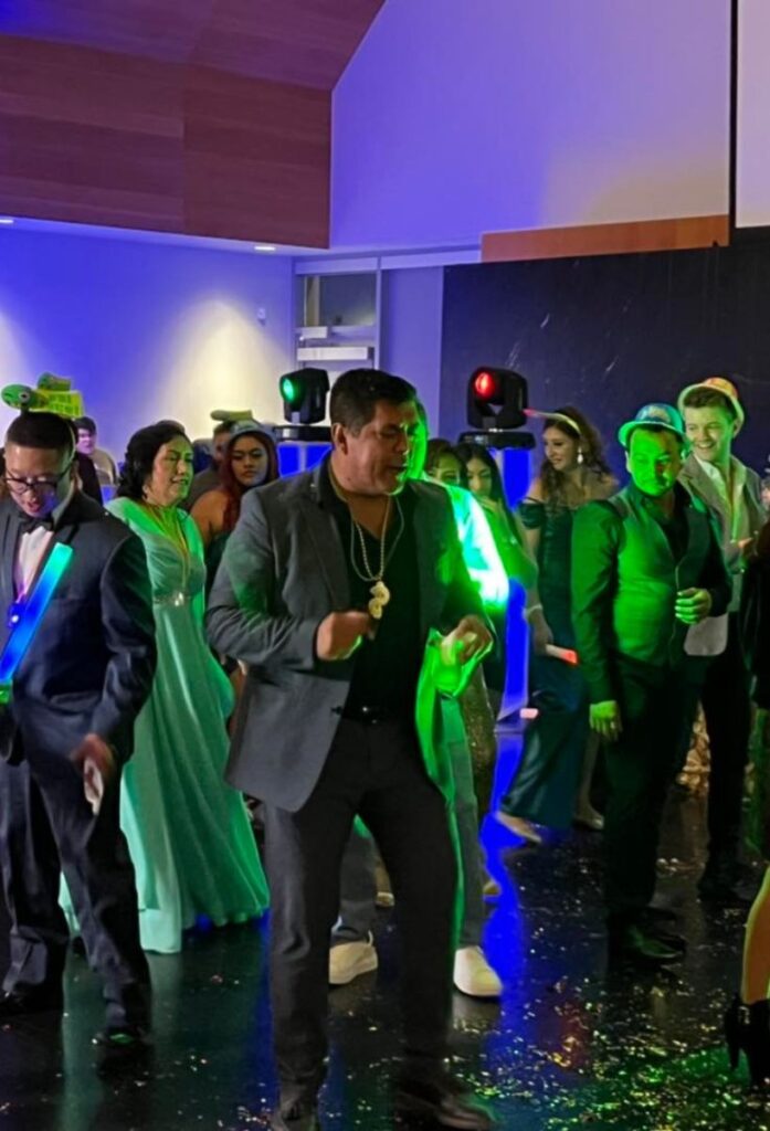 "Guests enjoying a lively dance floor with colorful lighting at an event in Minneapolis.
